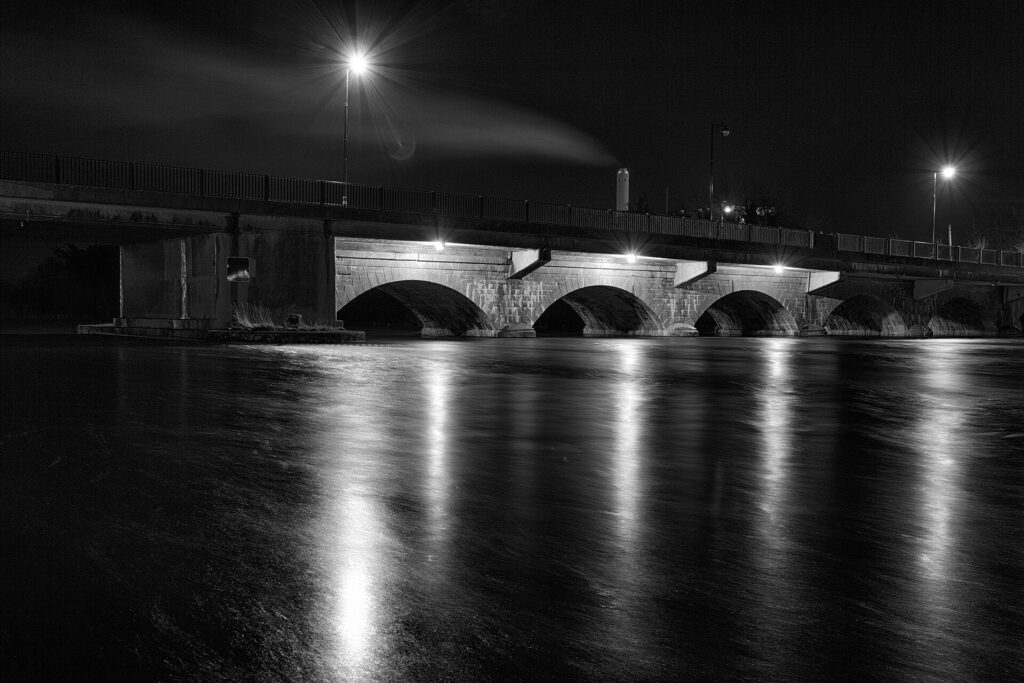 Lanesborough Bridge reflected in the Shannon at night